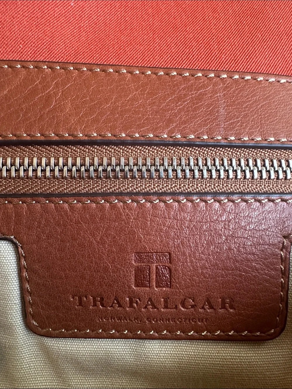 Trafalgar men’s messenger bag burnt orange with leather trim! Live New